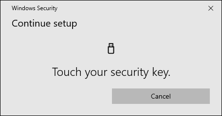 Touching security key to configure it.